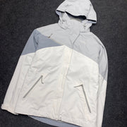 Grey and White North Face Raincoat Men's Medium